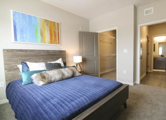 Bedroom with walk-in closet at WH Flats new luxury apartments in south Lincoln NE 68516