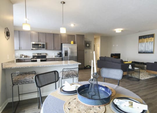 View of kitchen and living room from dining area at WH Flats new luxury apartments in south Lincoln NE 68516