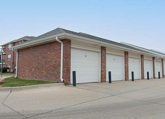 A long building with a row of garage doors