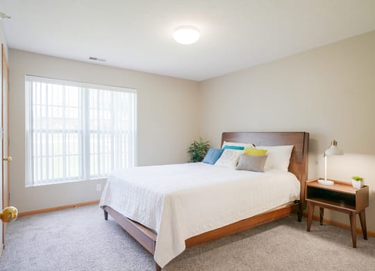 A furnished bedroom with a large bed and a window at Williamsburg Park