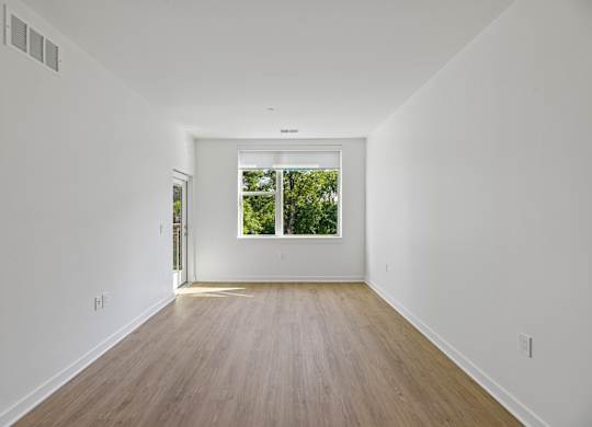 A long hallway with a door at the end.