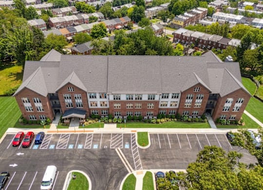 A large building with a parking lot in front of it.