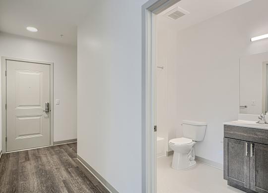 A bathroom with a toilet and sink.