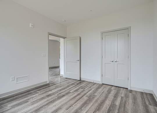 A room with a grey floor and white walls.