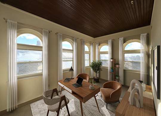 A room with a desk, chairs, and a television.