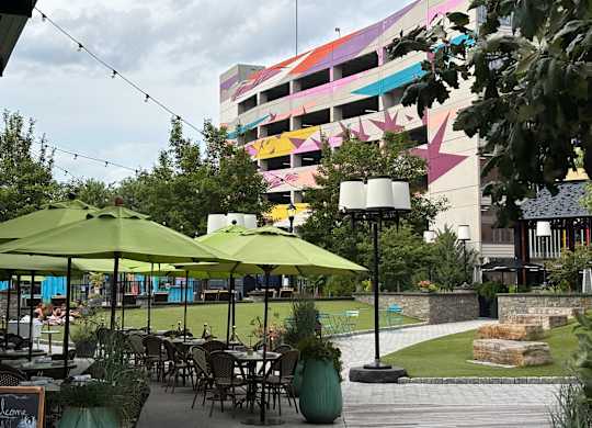 A colorful building with a rainbow of colors on the side.