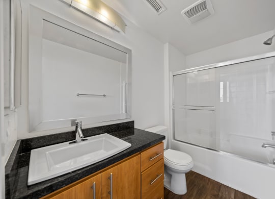 the preserve at ballantyne commons apartment bathroom with sink toilet and shower