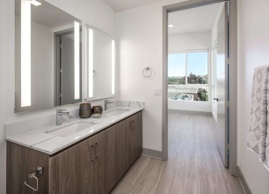 a bathroom with a large mirror and a sink