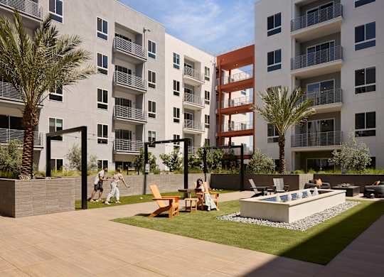 A modern apartment complex with a pool and a playground.