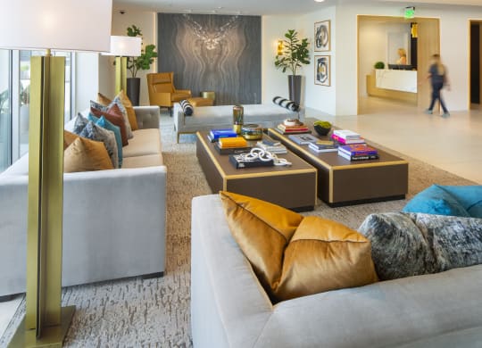 a large living room with couches and tables