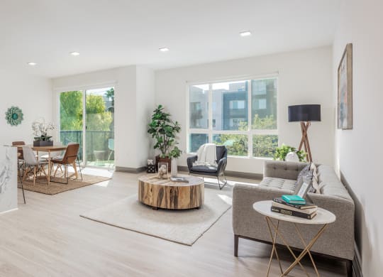 a living room with a kitchen and a dining room