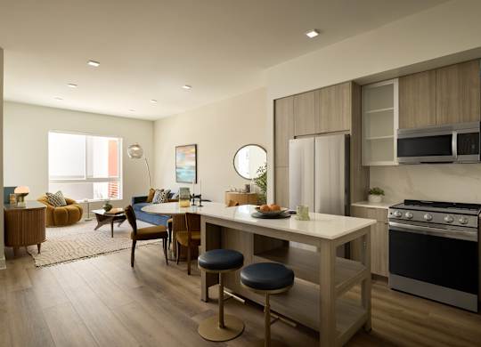 A modern kitchen with a dining table and chairs.