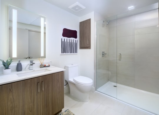 a bathroom with a toilet and a shower