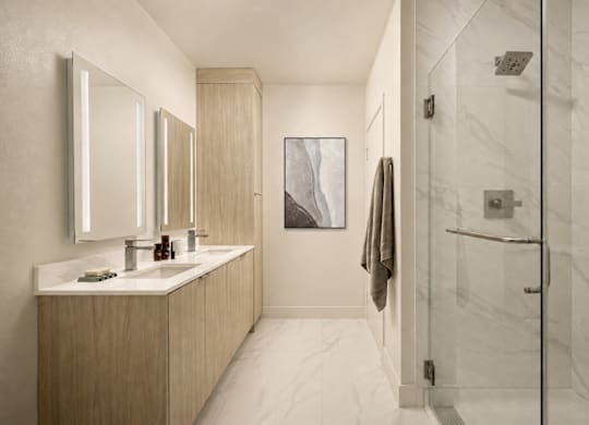 A bathroom with a white tiled floor and a white sink vanity with a mirror above it.