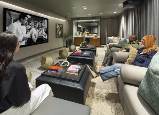 a living room filled with furniture and a large flat screen tv