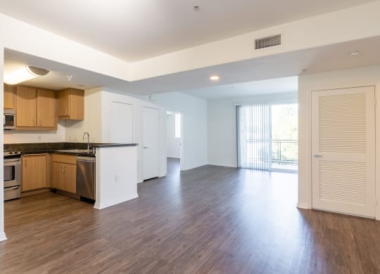 Open Living Room and Dining Room, High End Wood Laminate Flooring at Legacy Apartments, Northridge