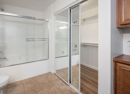 a bathroom with a shower and a toilet and a sink at Le Blanc Apartment Homes, Canoga Park, 91304