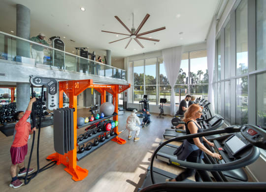a group of people exercising in a gym