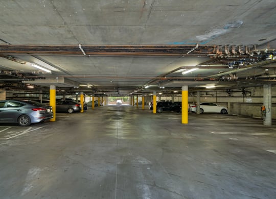 a parking garage with cars parked in it