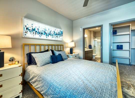 Bedroom with bed and bathroom at Cuvee, Glendale Arizona