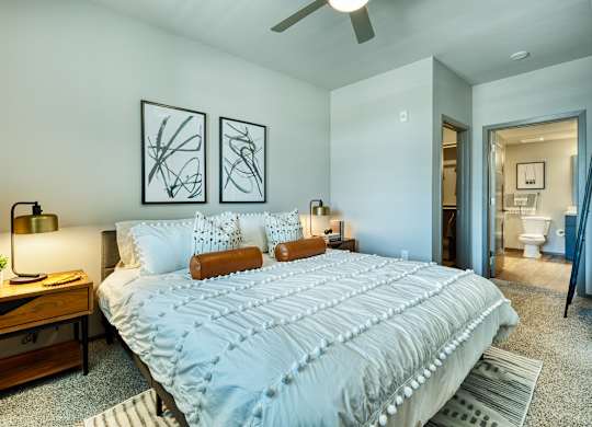 Bedroom with bed and bathroom at Cuvee, Glendale, AZ