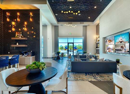 the lobby and clubhouse of Cuvee with blue couch at Cuvee, Glendale Arizona