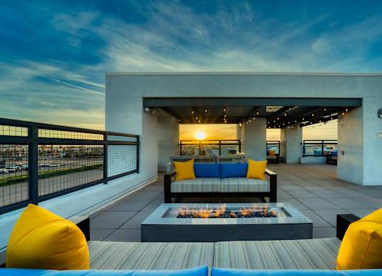 Rooftop patio with tables and chairs and firepit at Cuvee, Glendale, AZ 85305