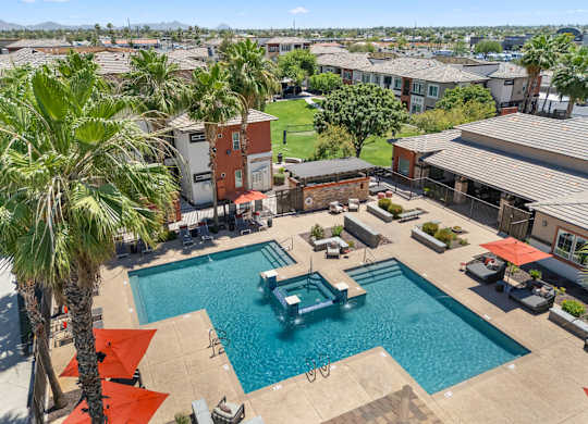 A pool with a fountain in the middle of it.