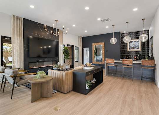 A modern living room with a fireplace and a television.