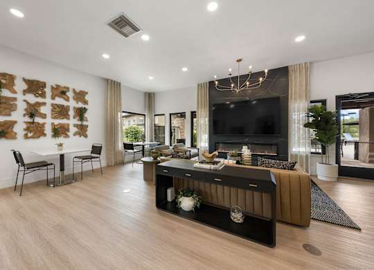A modern living room with a fireplace and a TV.