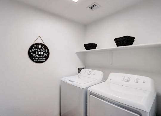 A laundry room with a washer and dryer.