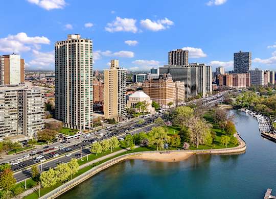 A cityscape with a river running through it.