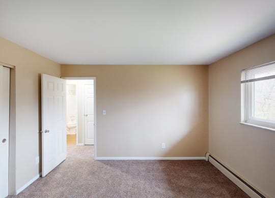 Bedroom with window light at Sharondale Woods Apartments, Cincinnati, 45241 