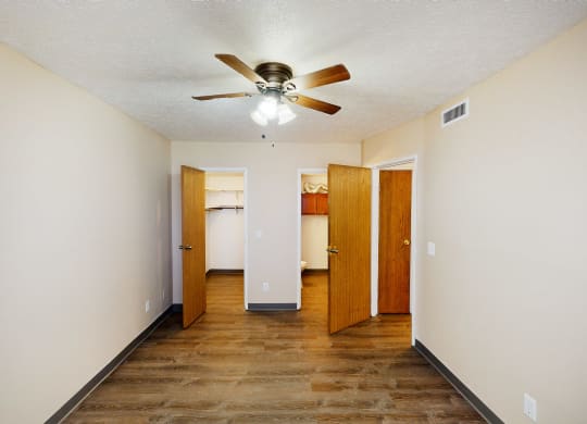 Bedroom with ceiling fan and light at Quail Meadow Apartments, Cincinnati, OH
