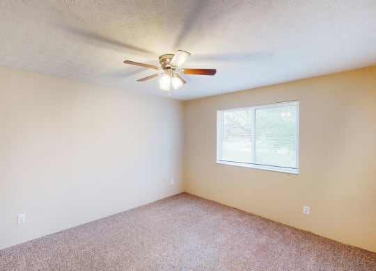Ceiling fan and light in bedroom at Quail Meadow Apartments, Cincinnati