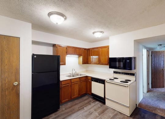 Wooden cabinets and black appliances1 at Quail Meadow Apartments, Cincinnati, 45240