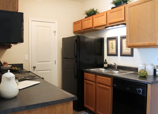 Kitchen with appliances and cabinets at Residences at Northgate Crossing, Columbus