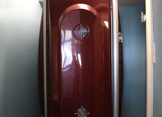 a red door with a reflection of a person in it  at Hunter's Creek Apartments, Cincinnati, OH