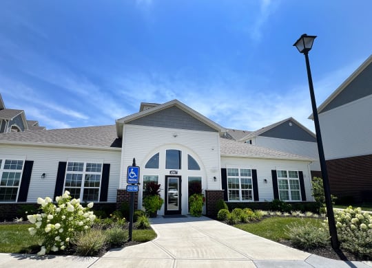a white building with a blue sign in front of it at Parkway Trails, Kentucky