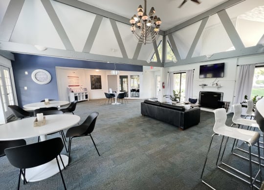 a large living room with tables and chairs and a couch at Miamisburg by the Mall, Miamisburg, 45342