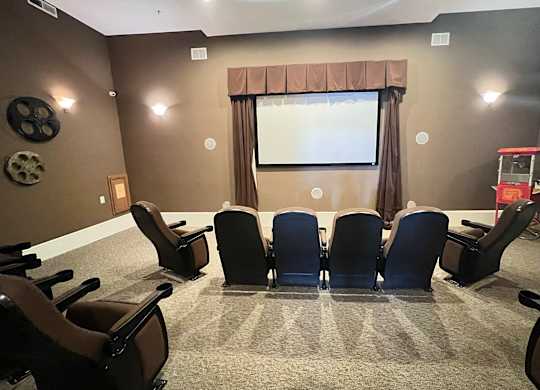 a conference room with a projector screen and chairs at Liberty Crossing, Columbus, 43235