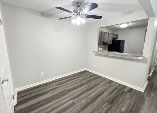 a living room with wood flooring and a ceiling fan at Fox Run Apartments, Cincinnati