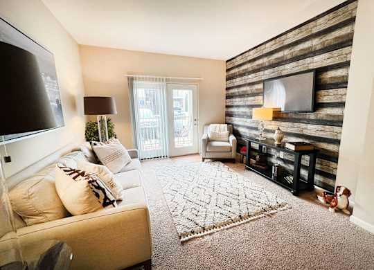 the living room of a home with a couch and a tv at Liberty Crossing, Columbus, 43235
