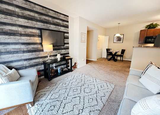 an open living room with a couch and a tv