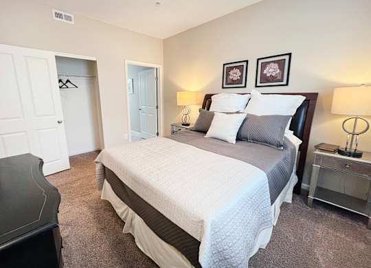 a bedroom with a bed and a dresser and a closet at Liberty Crossing, Columbus, 43235