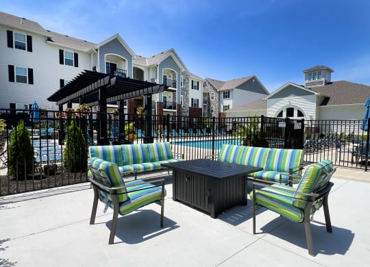 our apartments have a large patio with furniture and a pool at Parkway Trails, Florence, 41042