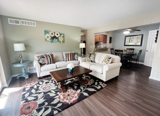 a living room with two couches and a coffee table at Fox Run Apartments, Cincinnati