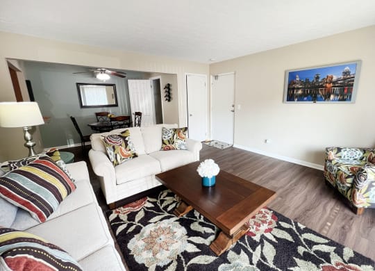 a living room with couches and a coffee table at Fox Run Apartments, Cincinnati