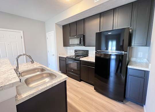 Kitchen with Black Appliances at Hebron Station Apartments, Kentucky, 41048