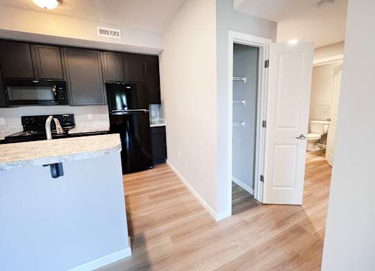 Kitchen with Black Cabinets at Hebron Station Apartments, Kentucky